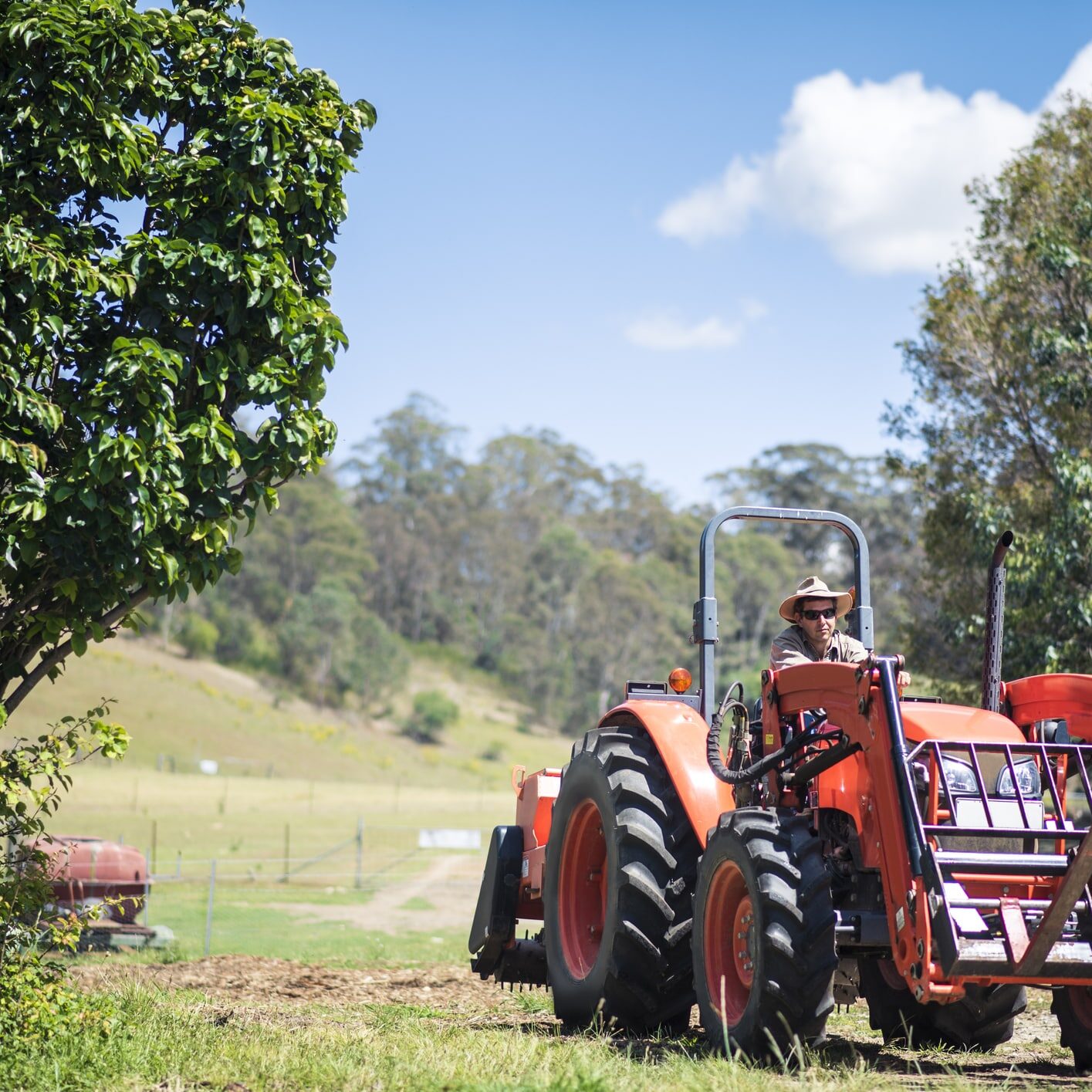 Farmer driving his combine harvester